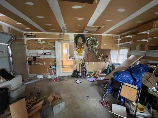 interior space featuring concrete flooring and a garage