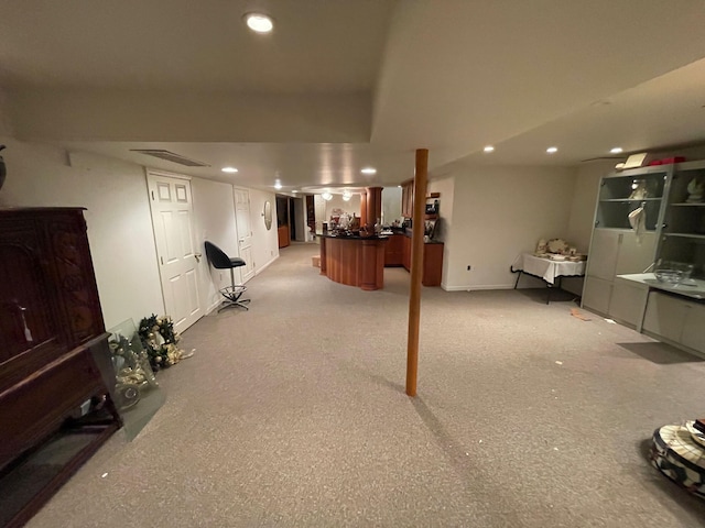 finished basement featuring baseboards, recessed lighting, and visible vents