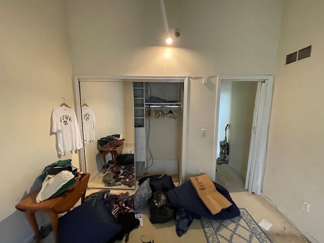 bedroom featuring a closet and visible vents