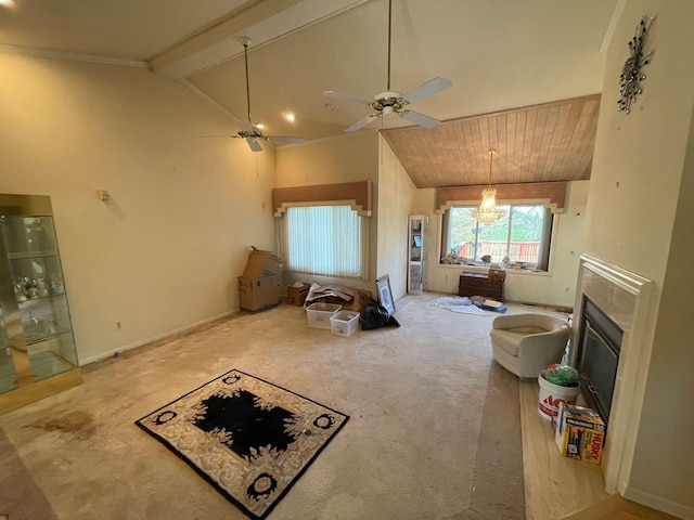 living room with a glass covered fireplace, carpet floors, lofted ceiling with beams, and ceiling fan with notable chandelier