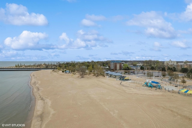 birds eye view of property with a view of the beach and a water view