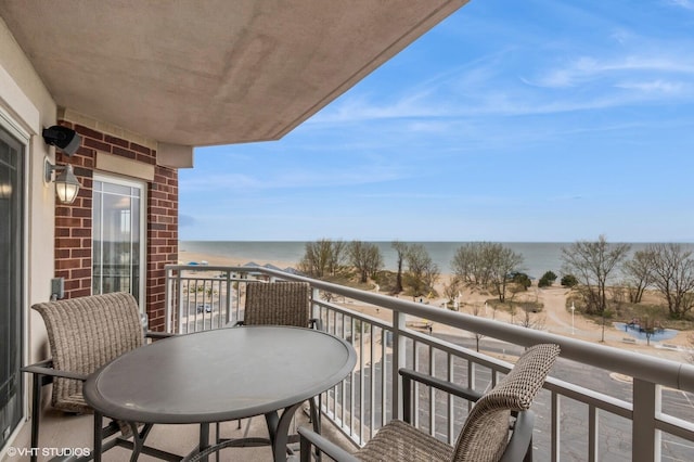 balcony featuring a water view