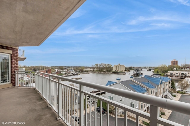 balcony featuring a water view