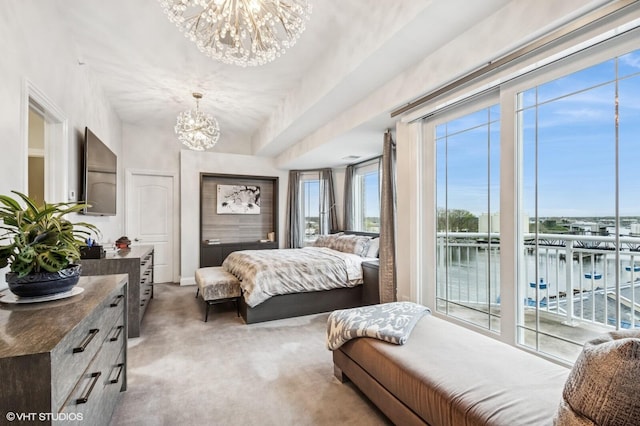 bedroom with access to outside, a chandelier, and light carpet