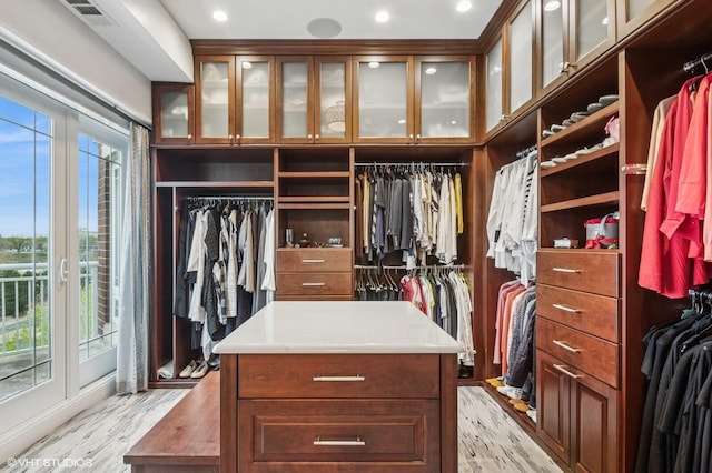 walk in closet featuring visible vents and light wood finished floors