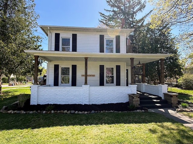 view of front facade with a porch and a front yard