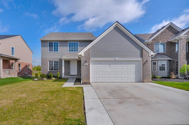 traditional-style home featuring a front lawn, brick siding, driveway, and a garage