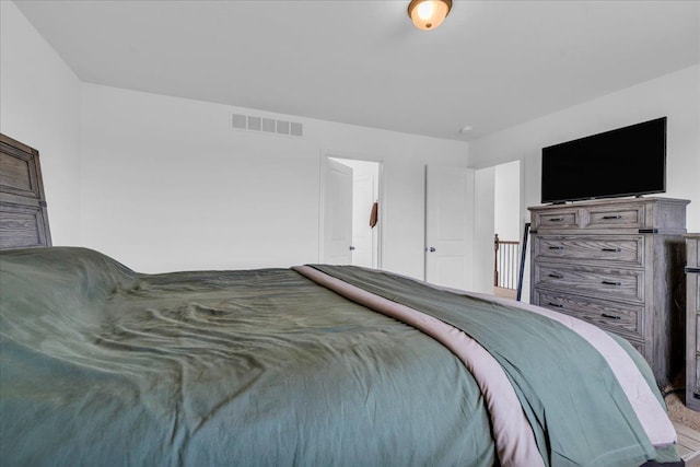 bedroom featuring visible vents
