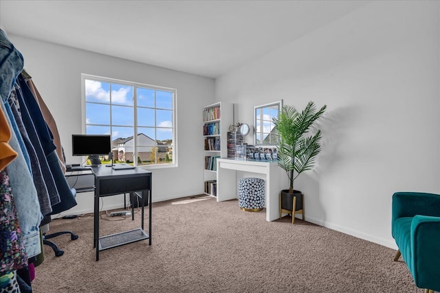 carpeted office space with baseboards