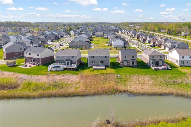 aerial view featuring a water view and a residential view