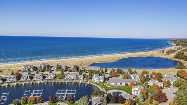 aerial view with a view of the beach and a water view