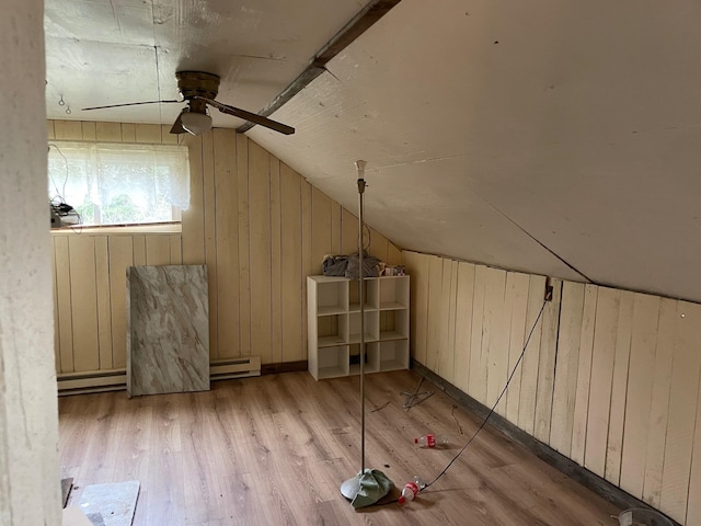 16206 Peters Farm Rd, Irons, MI 49644 - bonus room with a ceiling fan, baseboard heating, wood finished floors, lofted ceiling, and wooden walls