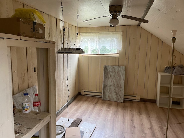 16206 Peters Farm Rd, Irons, MI 49644 - bonus room with wooden walls, baseboard heating, light wood-style flooring, a ceiling fan, and vaulted ceiling