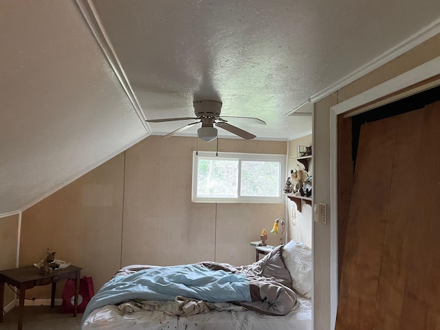 16206 Peters Farm Rd, Irons, MI 49644 - bedroom featuring a textured ceiling, vaulted ceiling, and ceiling fan