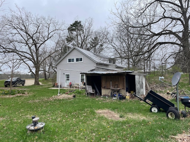 16206 Peters Farm Rd, Irons, MI 49644 - back of house featuring a lawn