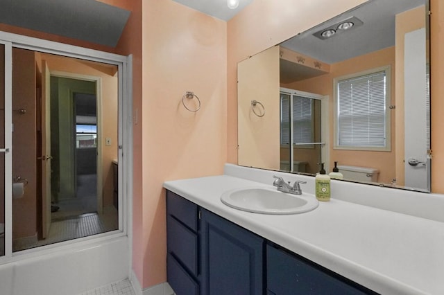 bathroom with vanity, a stall shower, and toilet