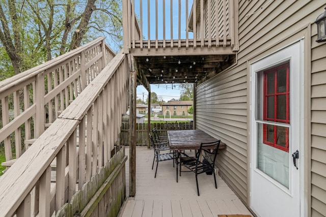 deck with fence and outdoor dining area