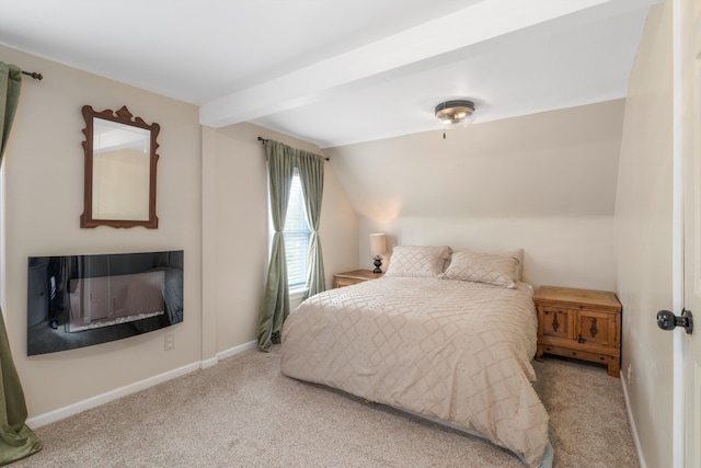 carpeted bedroom with beamed ceiling and baseboards