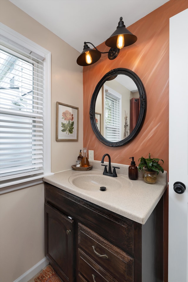 bathroom featuring vanity and baseboards