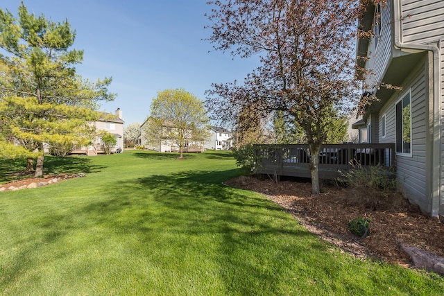 view of yard with a wooden deck