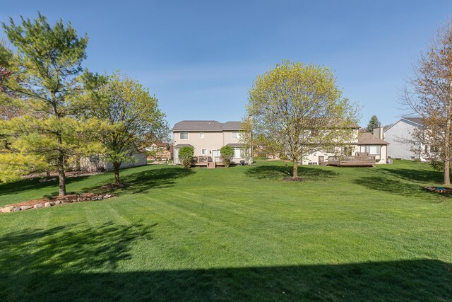 view of yard with a deck