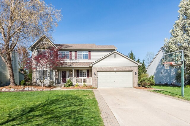 traditional home with a porch, brick siding, an attached garage, and a front yard