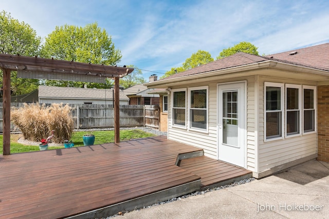 wooden terrace featuring fence and a pergola