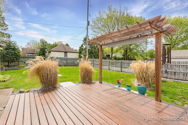deck featuring a yard and a fenced backyard