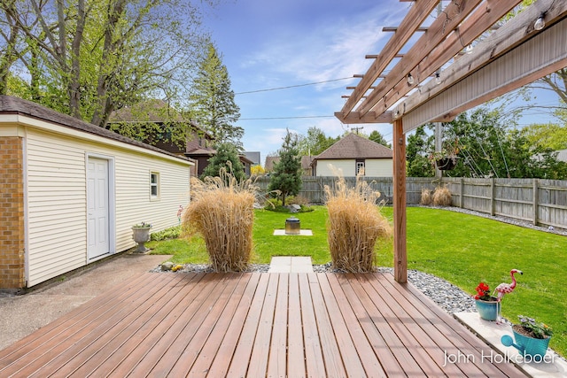 wooden terrace with a fenced backyard, a pergola, and a yard