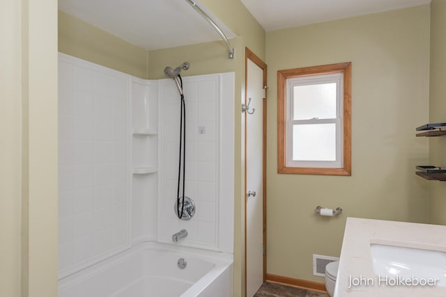bathroom with visible vents, baseboards, tub / shower combination, and toilet