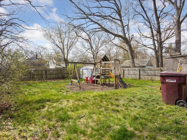 view of yard featuring a fenced backyard and a playground