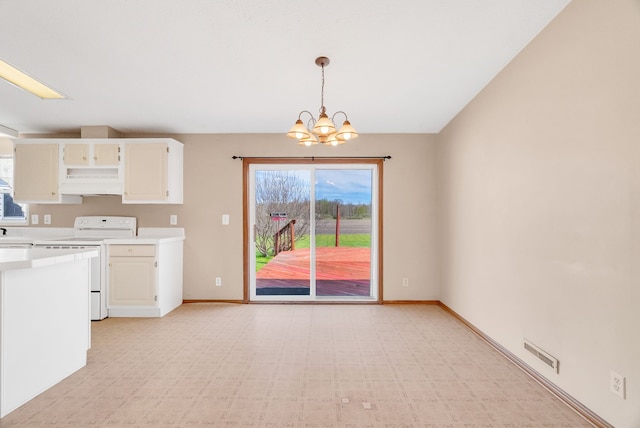 2326 Burnsline Rd, Brown City, MI 48416 - kitchen featuring white range with electric stovetop, light flooring, premium range hood, a chandelier, and light countertops