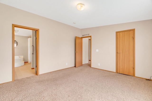2326 Burnsline Rd, Brown City, MI 48416 - unfurnished bedroom featuring light colored carpet, baseboards, and ensuite bathroom