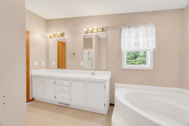 2326 Burnsline Rd, Brown City, MI 48416 - bathroom with a bath, double vanity, and baseboards