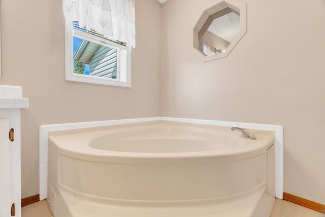 2326 Burnsline Rd, Brown City, MI 48416 - bathroom featuring a bath, baseboards, and tile patterned floors