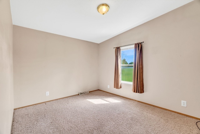 2326 Burnsline Rd, Brown City, MI 48416 - carpeted spare room with vaulted ceiling and baseboards