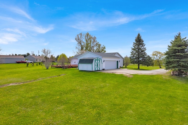 2326 Burnsline Rd, Brown City, MI 48416 - view of green lawn with concrete driveway and an outdoor structure
