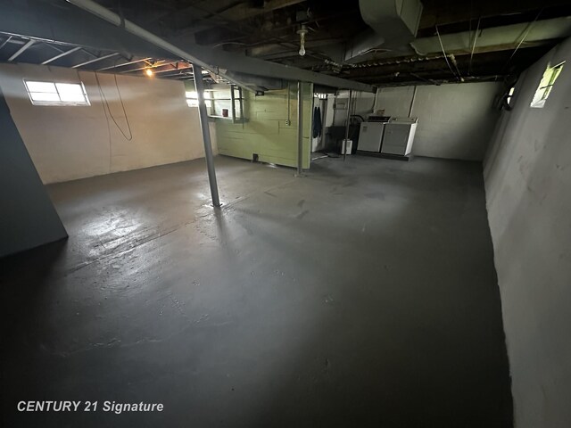 basement with washing machine and clothes dryer