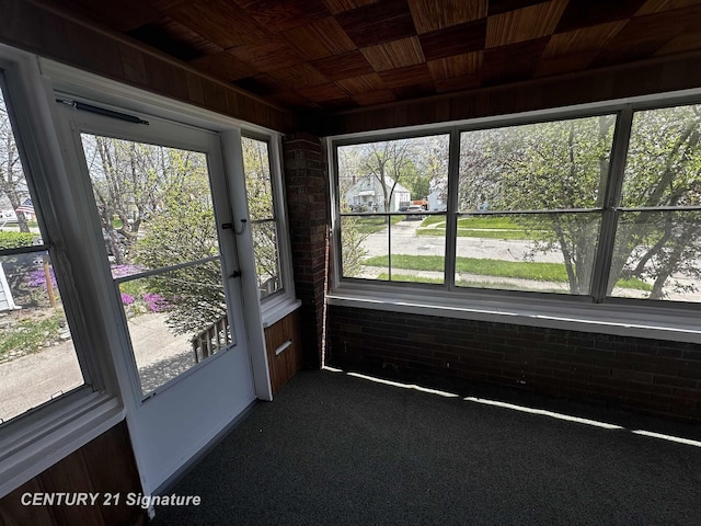 unfurnished sunroom featuring a wealth of natural light