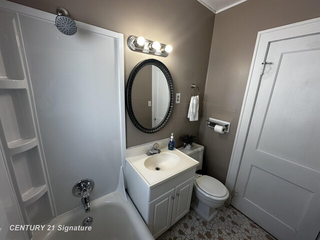 full bathroom with shower / bathing tub combination, tile walls, tile patterned flooring, vanity, and toilet