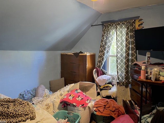 bedroom with lofted ceiling