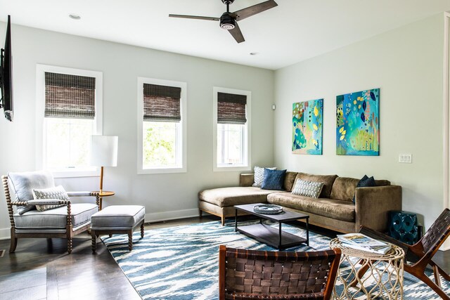 living room with a ceiling fan, baseboards, recessed lighting, and wood finished floors