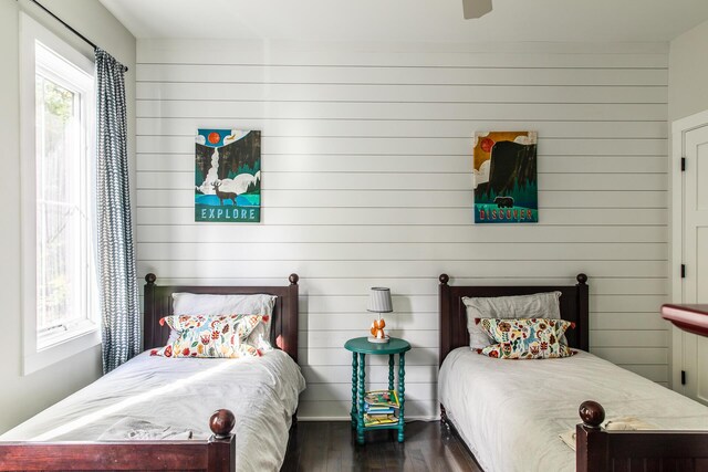 bedroom with dark wood-type flooring