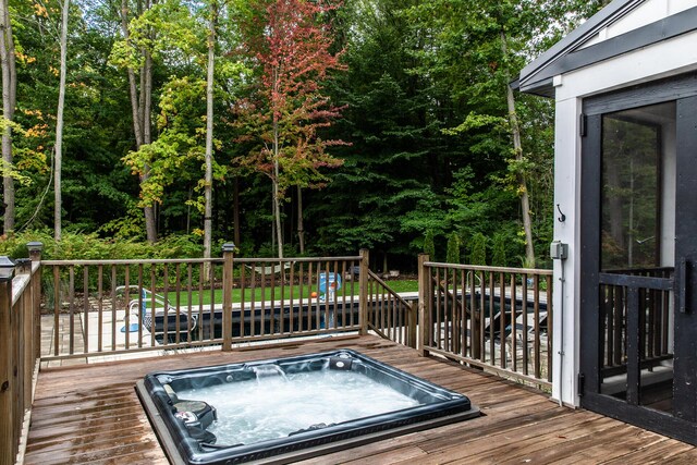 wooden deck with hot tub deck surround