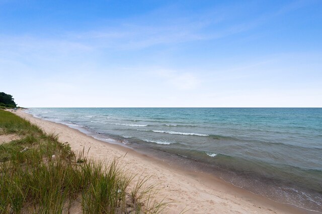 property view of water with a beach view