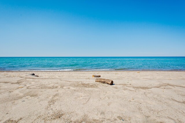 view of water feature with a beach view