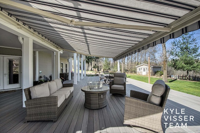 deck with a yard and an outdoor living space