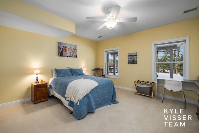 bedroom featuring baseboards, ceiling fan, light carpet, and visible vents