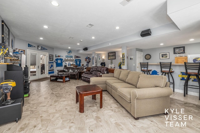 living room with recessed lighting, baseboards, and visible vents
