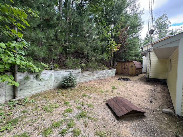 5940 Oak Rd, Rose City, MI 48654 - view of yard with an outdoor structure, fence, and a storage unit